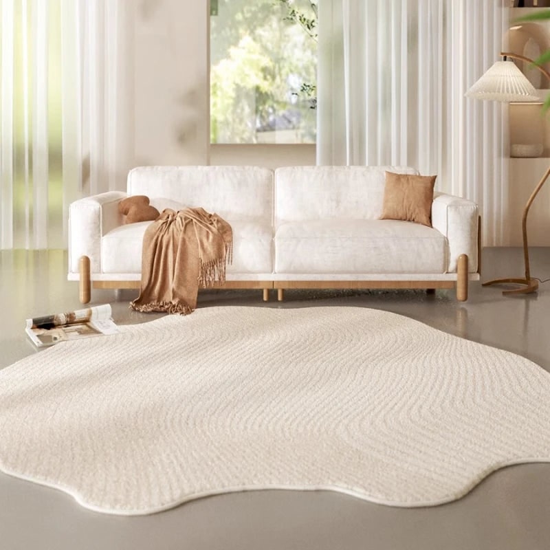 Area Rug with Irregular Wavy Edge and Textured Plush Pile Pattern - Image 1