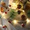 Battery Operated LED Christmas Garland Lights with Warm White Pine Cones and Berries - Image 1