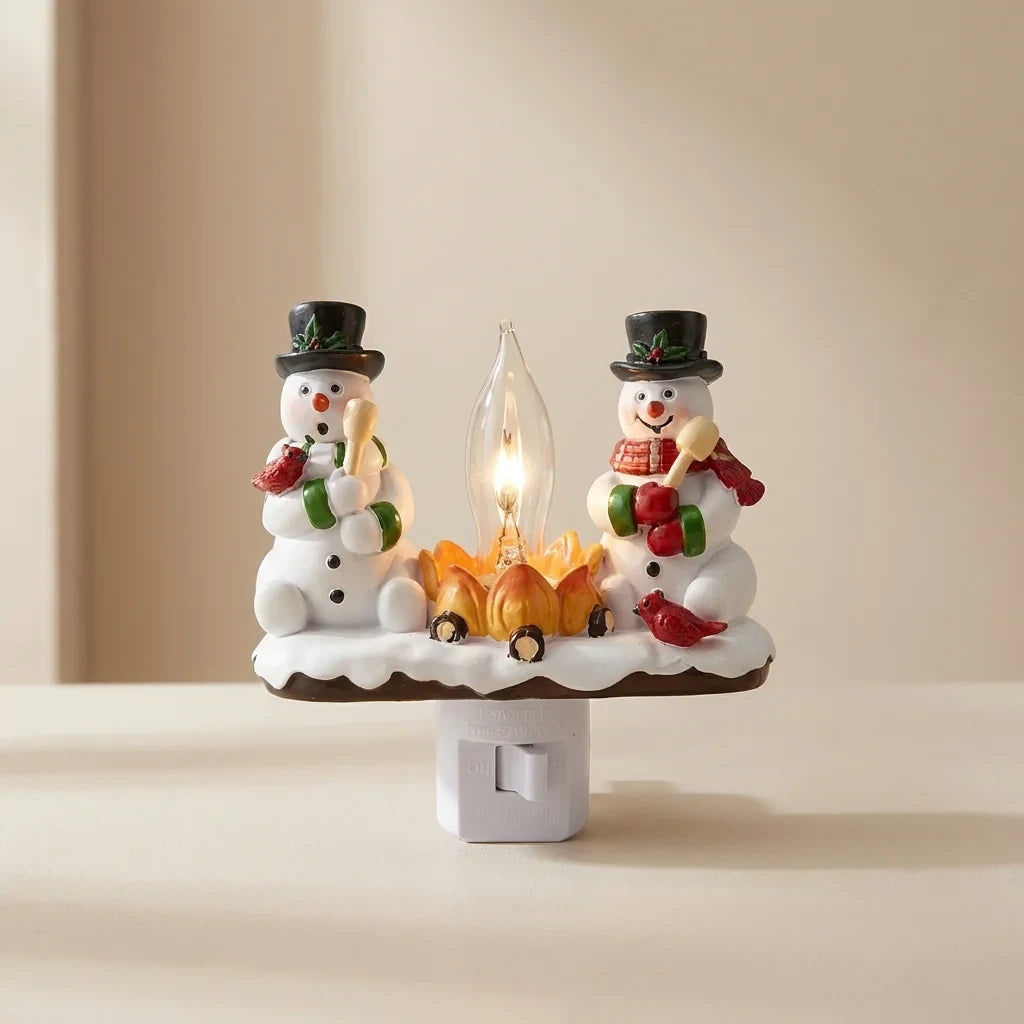 Christmas Night Lights with Snowman Campfire Design Plug-In Resin Figurines and Warm Yellow - Image 1